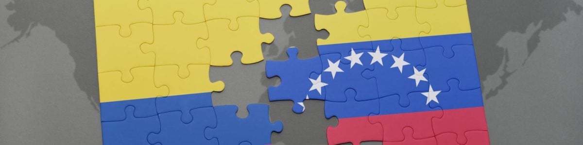 puzzle with the national flag of colombia and venezuela on a world map background. 3D illustration