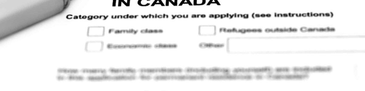 Visa application form filling with silver ballpoint
