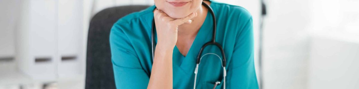 Young female doctor in medical office. Portrait of beautiful fem