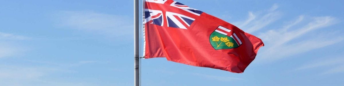 Ontario flag in a blue skies