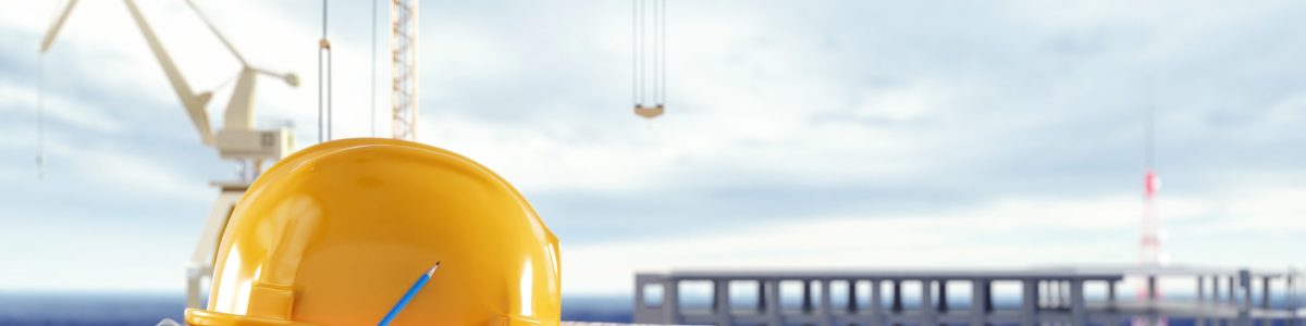 Construction safety equipment with cranes in front of the unfini