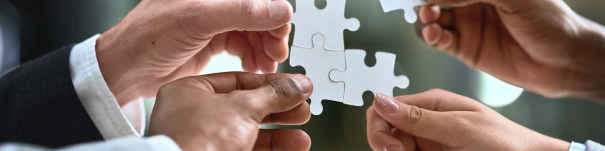 Puzzle, business hands and group of people for solution, teamwork and goals, integration or workflow success. Team building, games and development of person problem solving, synergy or collaboration.