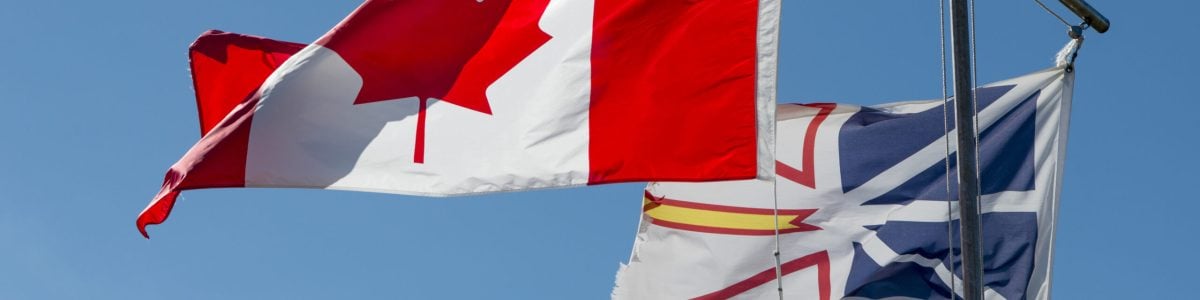 Low angle view of Canadian and Newfoundland flags, Twillingate, South Twillingate Island, Newfoundland And Labrador, Canada