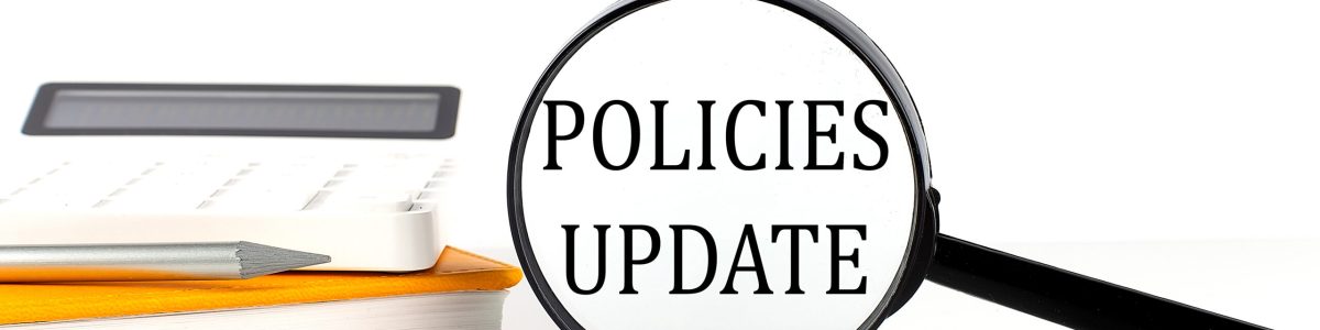 Magnifier with text POLICIES UDATE with notebook, calculator on the white background