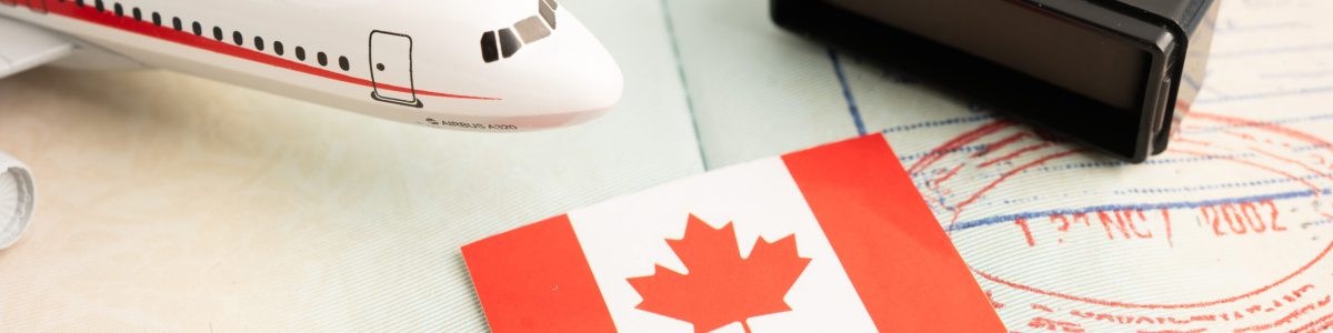 Canada flag with passport and airplane for travel.