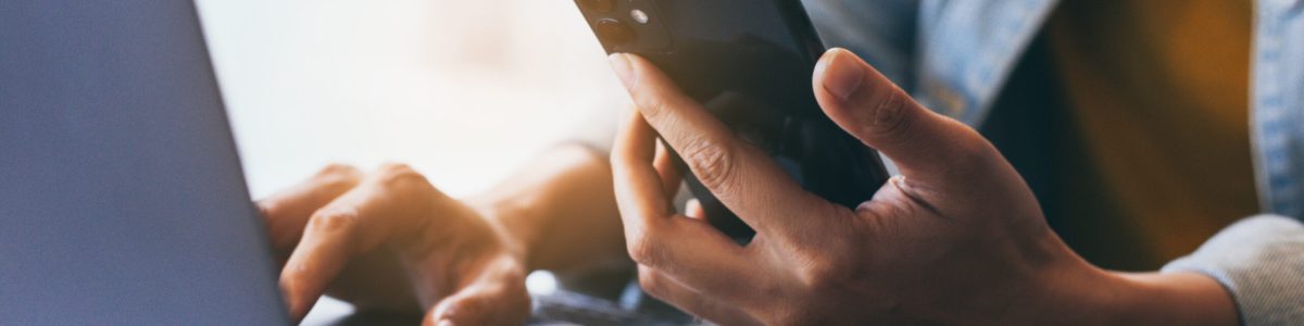 work using texting cell phone typing computer.chatting on mobile,laptop contact us at workplace Thinking investment plan Investor.searching information internet.connecting people concept