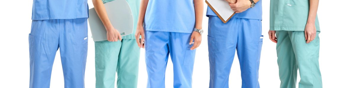 Smiling medical people with stethoscopes. Doctors and nurses over white background